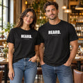 Man and woman in a restaurant wearing black Chef Diablo HEARD. t-shirts